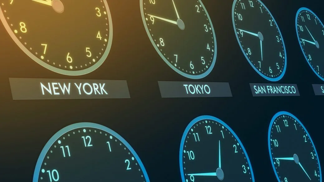 A wall of clocks labelled New York, Tokyo and San Francisco showing different times.